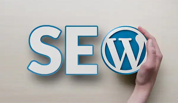 Hand holding WordPress logo next to SEO text, emphasizing WordPress SEO services.